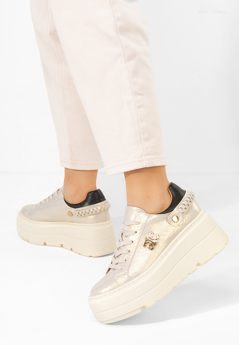 Złote sneakersy na platformie Blanch