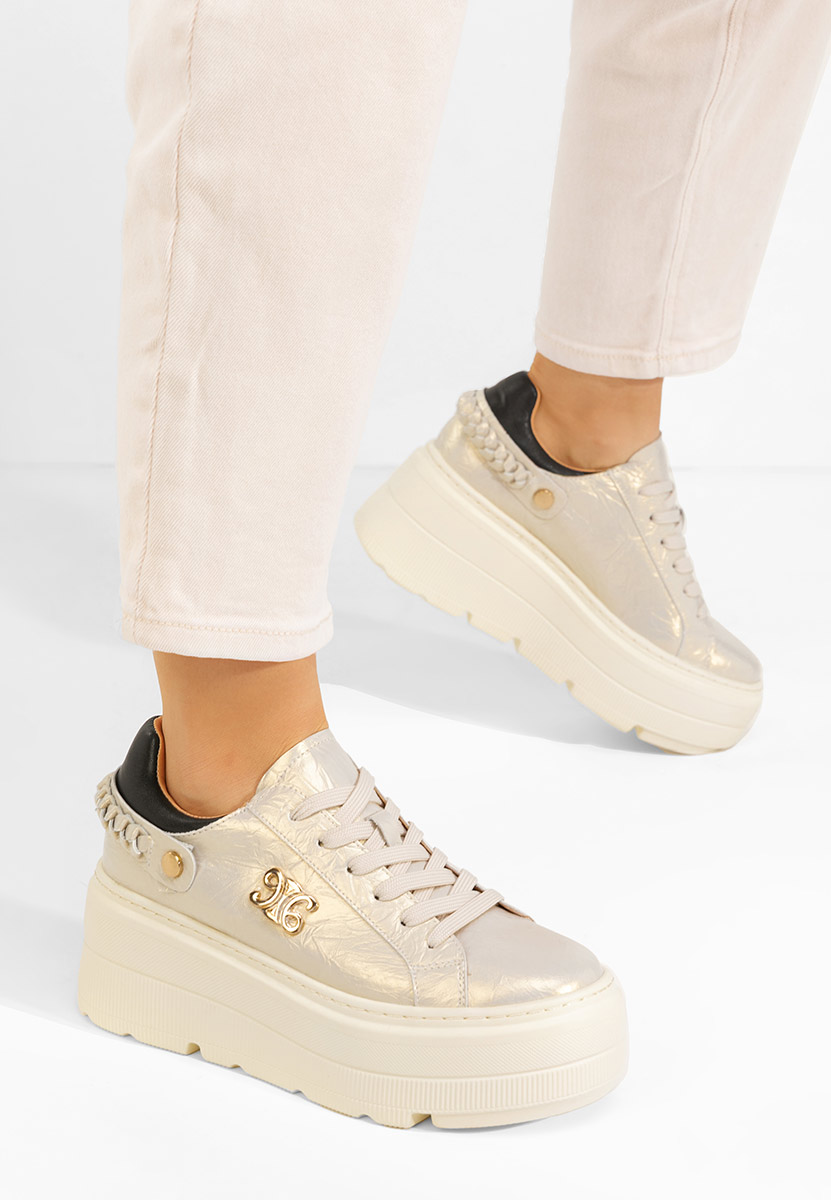 Złote sneakersy na platformie Blanch