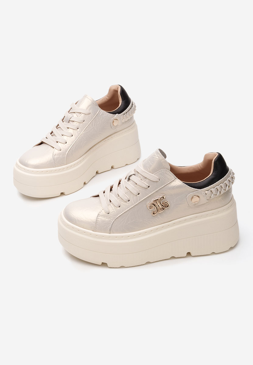 Złote sneakersy na platformie Blanch