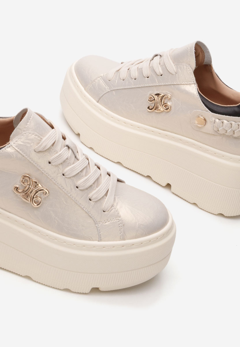 Złote sneakersy na platformie Blanch