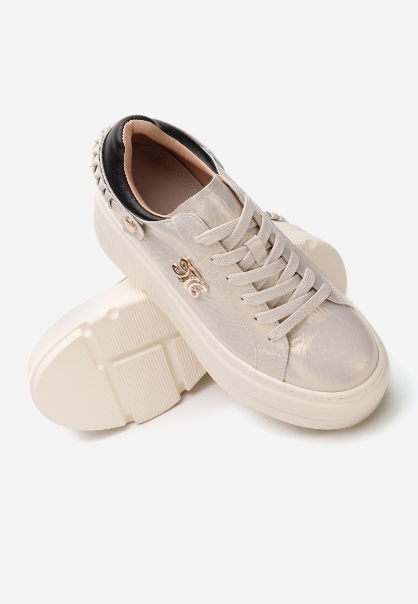 Złote sneakersy na platformie Blanch
