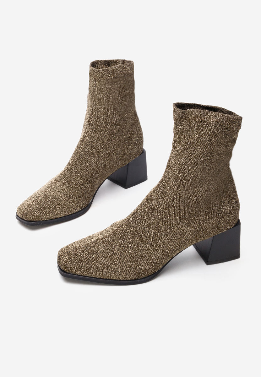 Złote botki na słupku Denonia V2