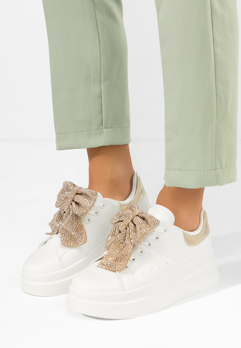 Złote sneakersy na platformie Anitta