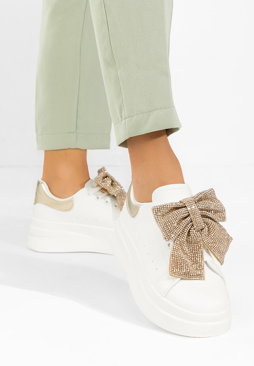 Złote sneakersy na platformie Anitta