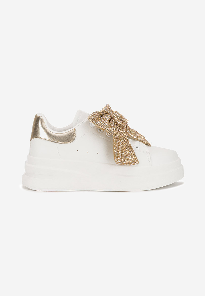Złote sneakersy na platformie Anitta