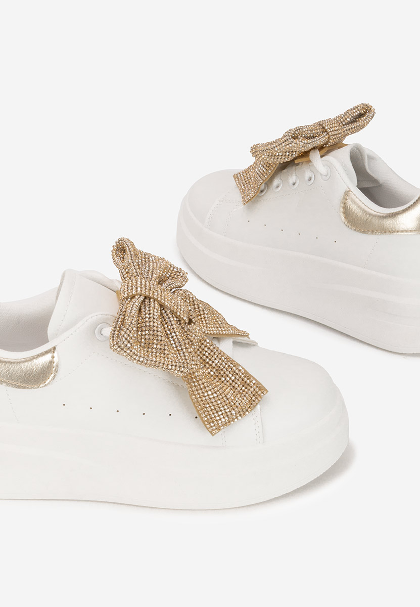 Złote sneakersy na platformie Anitta